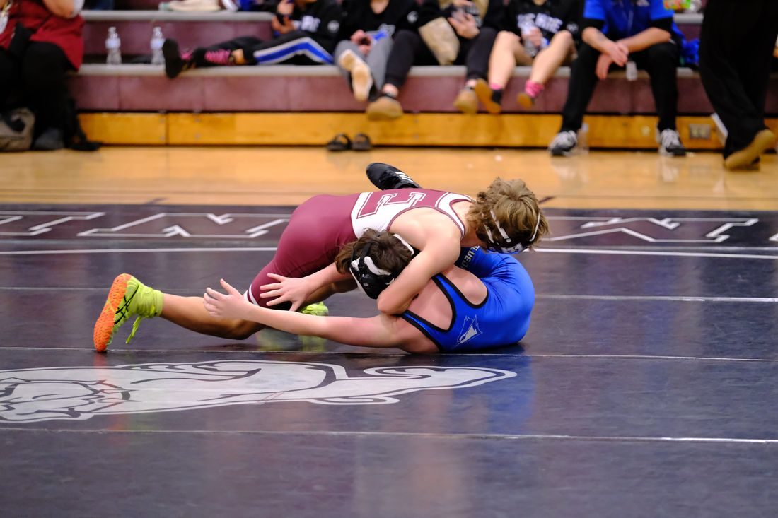 Edmond Memorial wrestler in a match