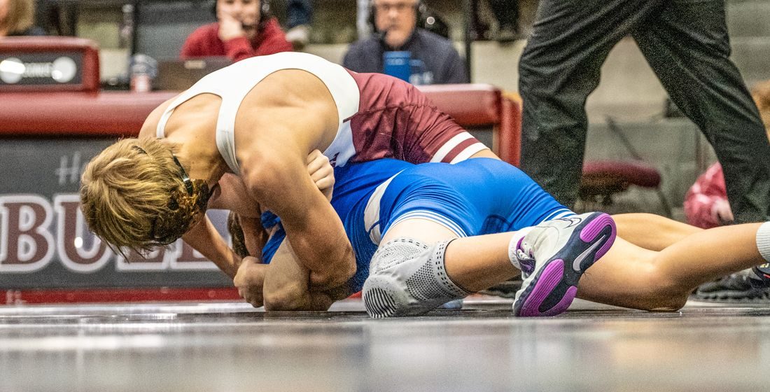 Edmond Memorial wrestler working for a turn